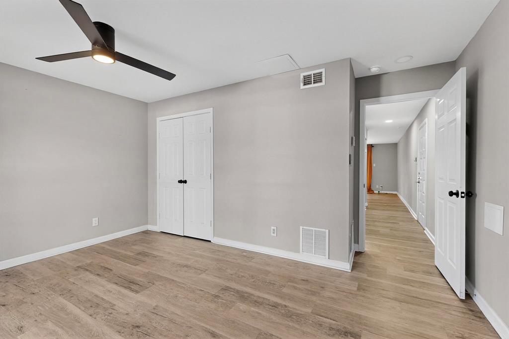 4535 North O'Connor Road, Unit 1210 Irving, TX 75062 - Photo 15 of 20 a view of an empty room with wooden floor