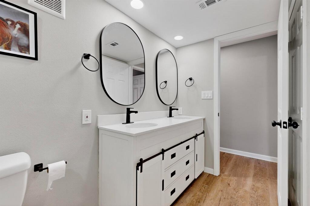 4535 North O'Connor Road, Unit 1210 Irving, TX 75062 - Photo 16 of 20 a bathroom with a sink double vanity and a mirror