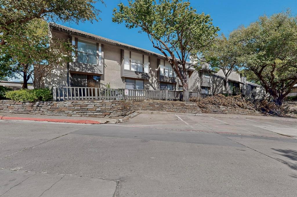 4535 North O'Connor Road, Unit 1210 Irving, TX 75062 - Photo 19 of 20 a street view along with residential houses