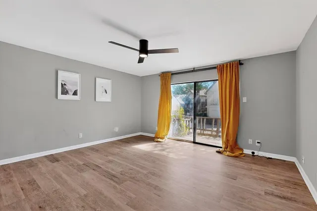 a view of an empty room with glass door