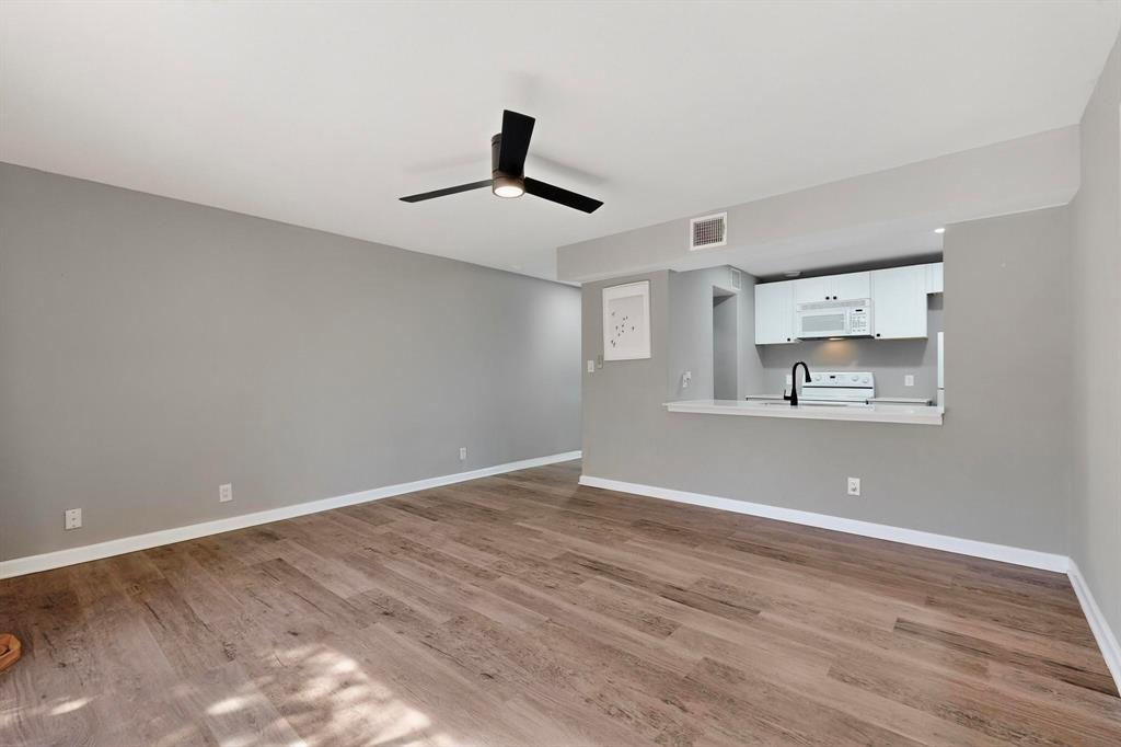 4535 North O'Connor Road, Unit 1210 Irving, TX 75062 - Photo 7 of 20 a view of an empty room with window and cabinet