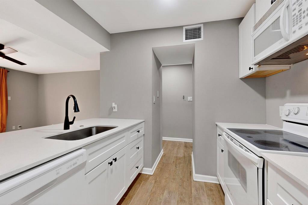 4535 North O'Connor Road, Unit 1210 Irving, TX 75062 - Photo 8 of 20 a kitchen with sink and cabinets