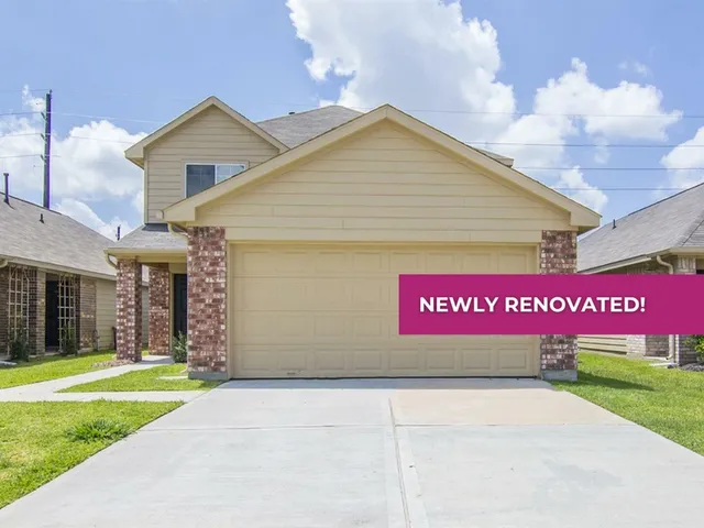 a sign that is sitting in front of a house