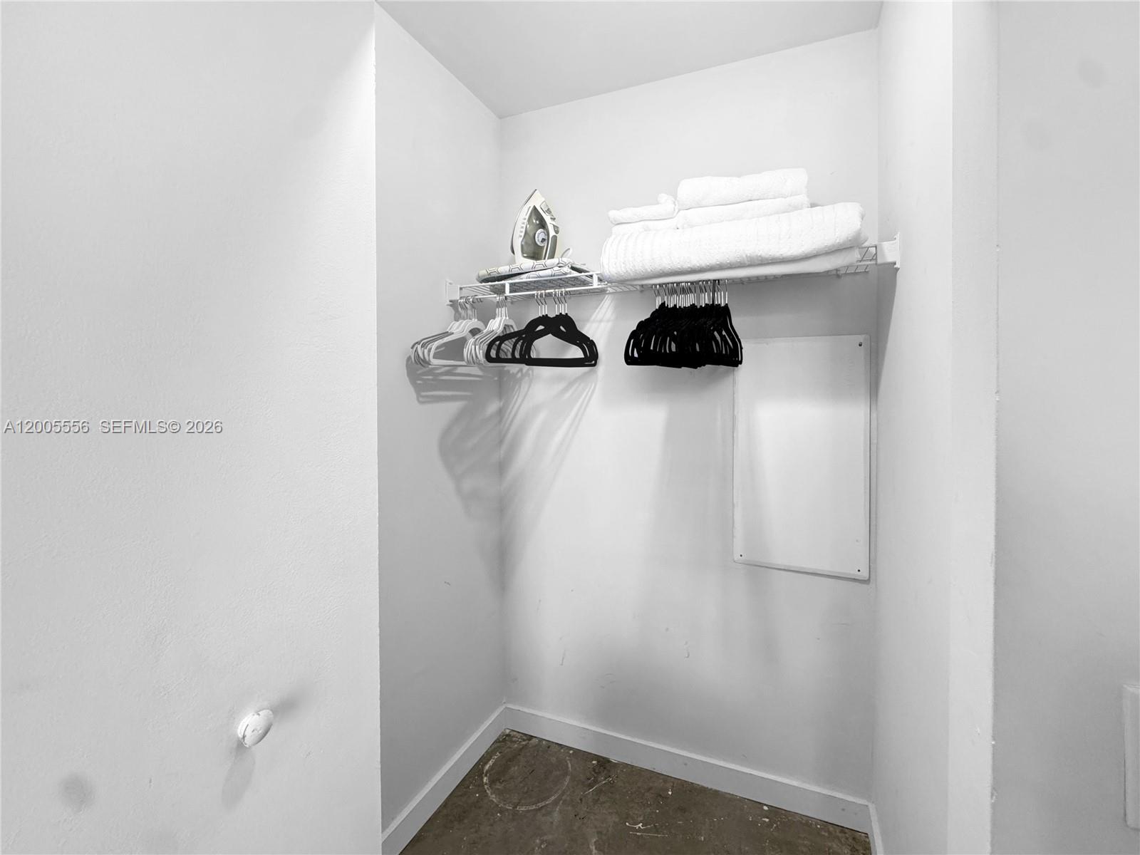 151 Southeast 1st Street, Unit 2702 Miami, FL 33131 - Photo 13 of 29 a view of small space with racks on the wall