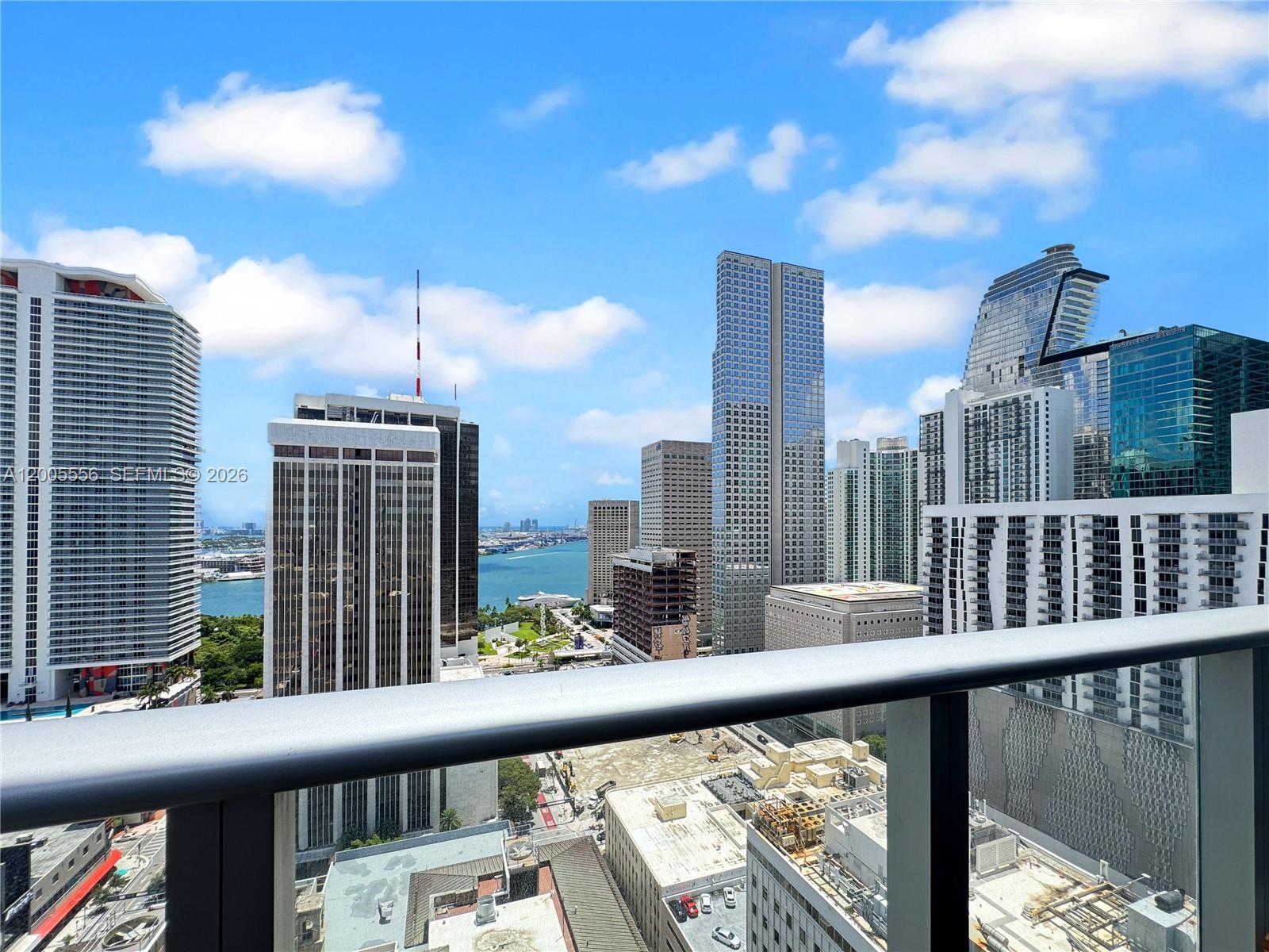 151 Southeast 1st Street, Unit 2702 Miami, FL 33131 - Photo 17 of 29 a view of city from a balcony
