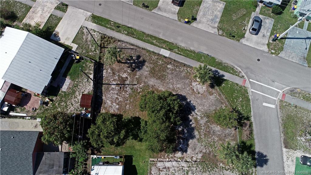 5152 Southeast Primrose Way Stuart, FL 34997 - Photo 12 of 13 an aerial view of a house