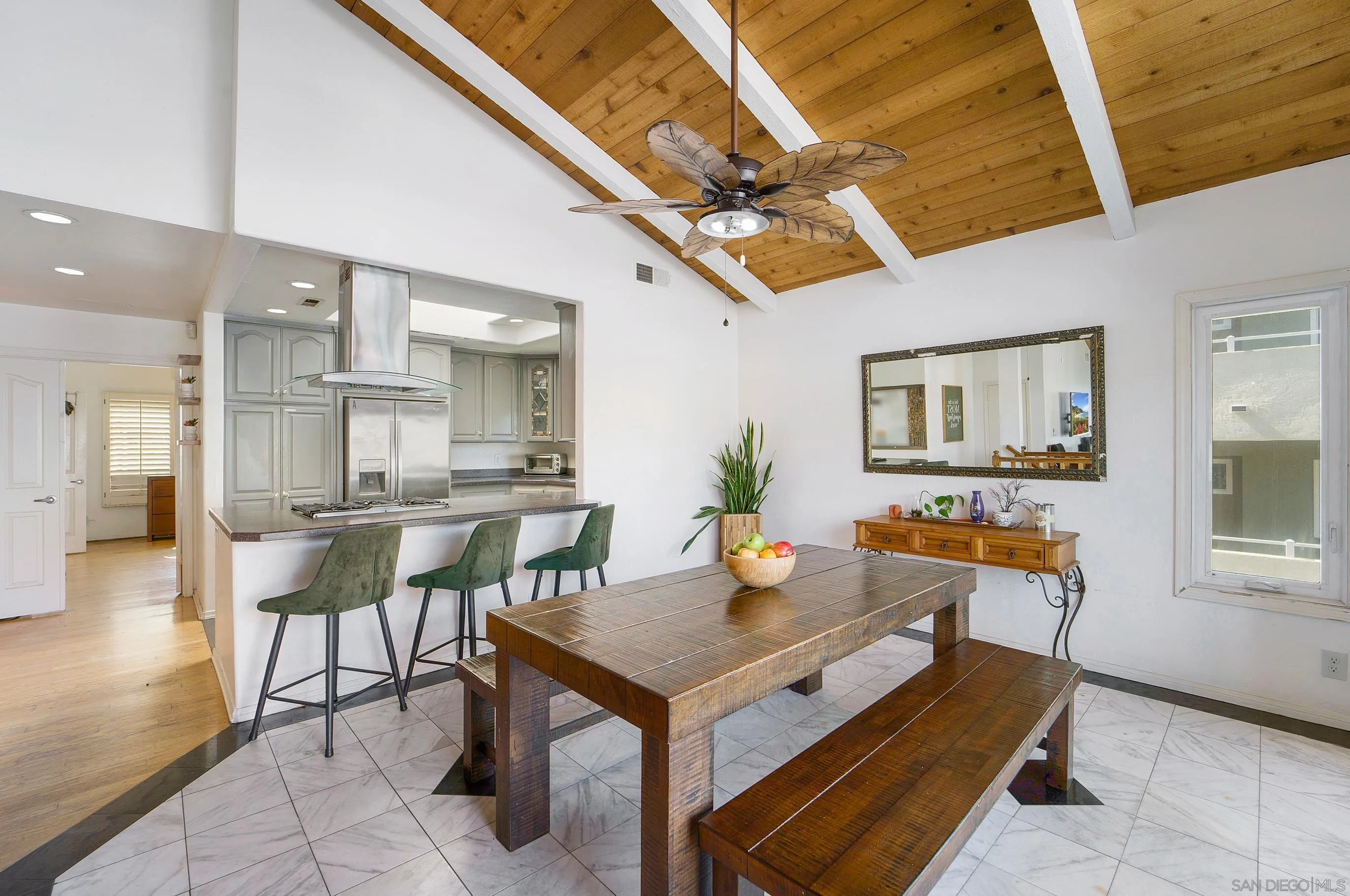149 Walnut Avenue Carlsbad, CA 92008 - Photo 11 of 48 a dining room with a table and chairs