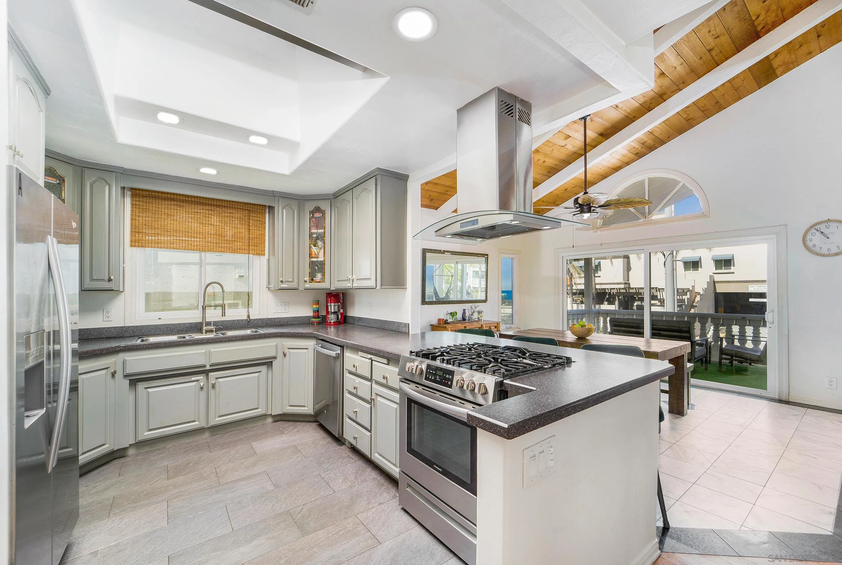 149 Walnut Avenue Carlsbad, CA 92008 - Photo 16 of 48 a kitchen with stainless steel appliances granite countertop a stove a sink and a refrigerator
