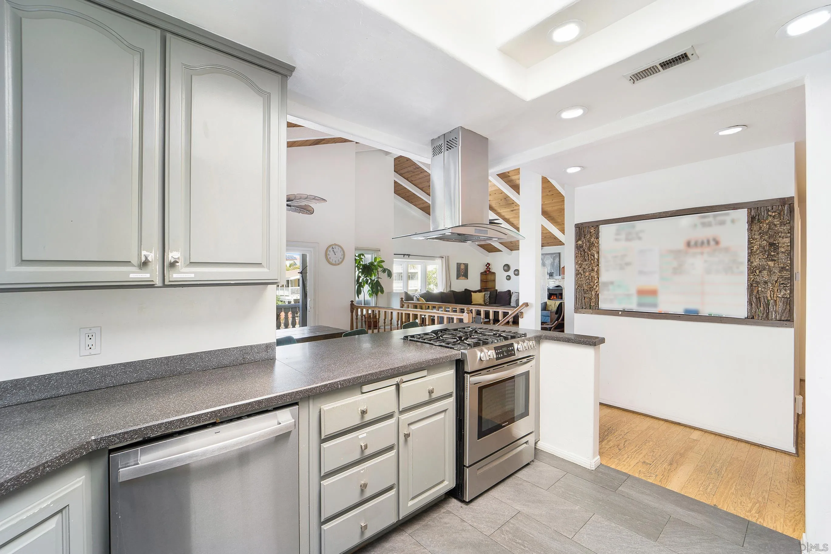 149 Walnut Avenue Carlsbad, CA 92008 - Photo 17 of 48 a kitchen with stainless steel appliances white cabinets and a granite counter tops