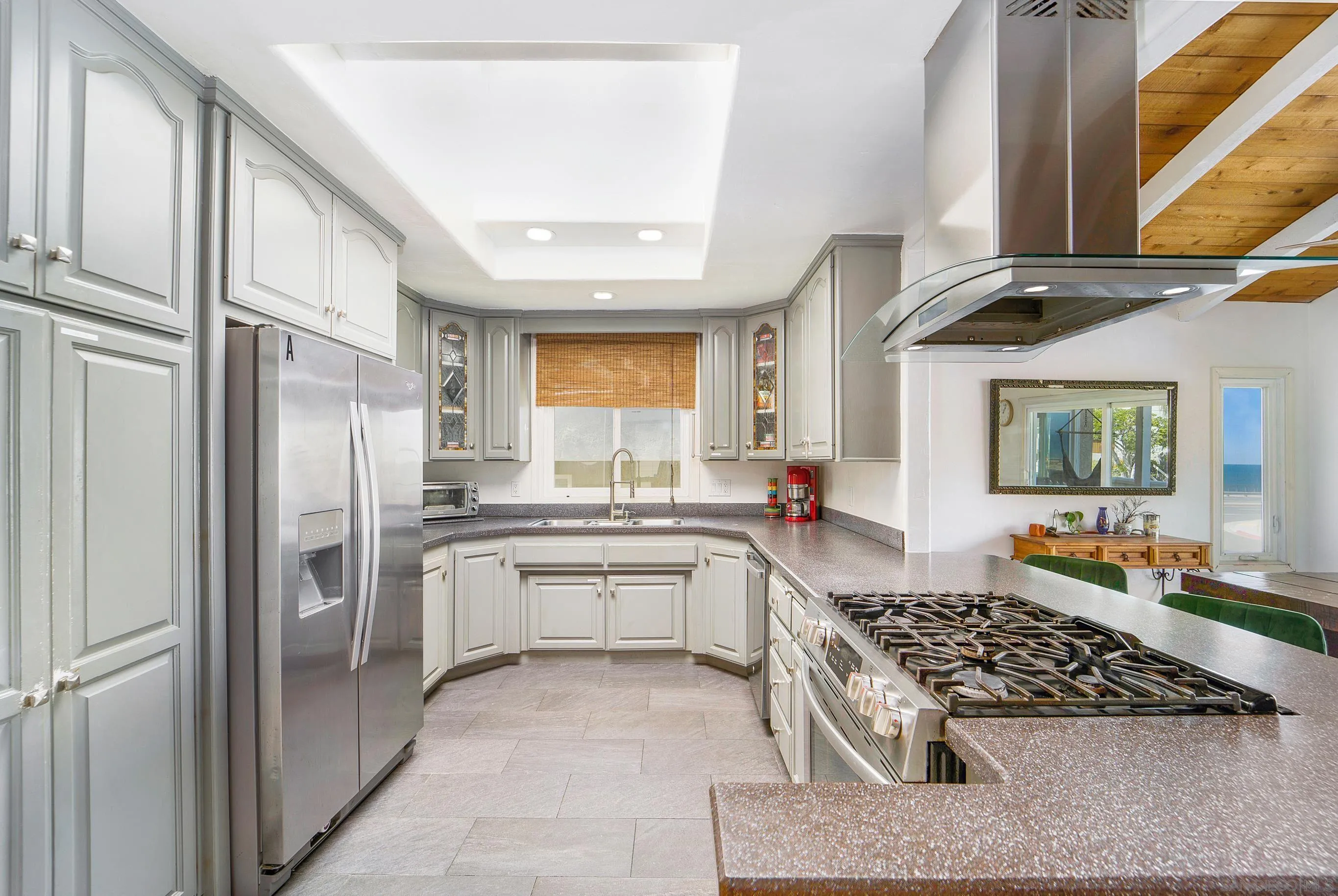 149 Walnut Avenue Carlsbad, CA 92008 - Photo 18 of 48 a kitchen with stainless steel appliances granite countertop a stove and a refrigerator