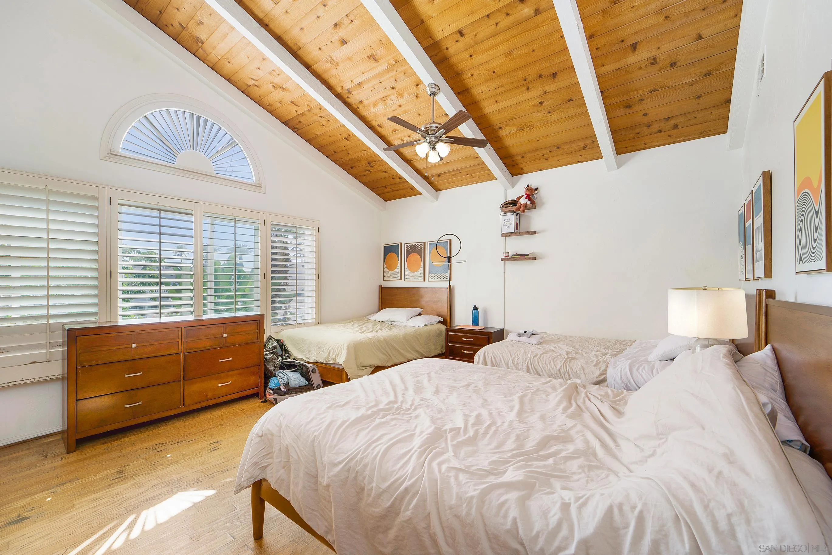 149 Walnut Avenue Carlsbad, CA 92008 - Photo 20 of 48 a bed room with two bed and a large window