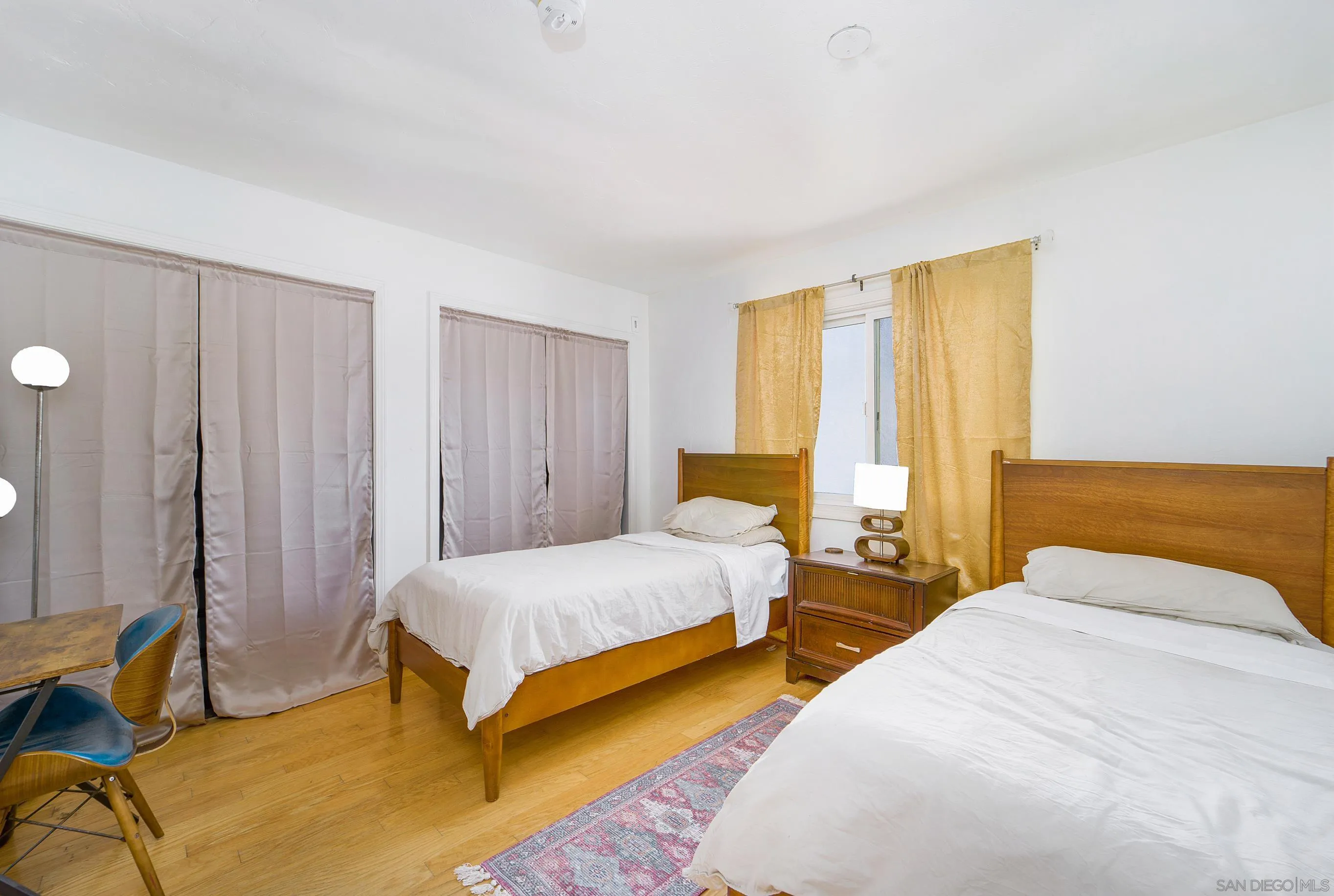 149 Walnut Avenue Carlsbad, CA 92008 - Photo 24 of 48 a bedroom with a bed and a couch