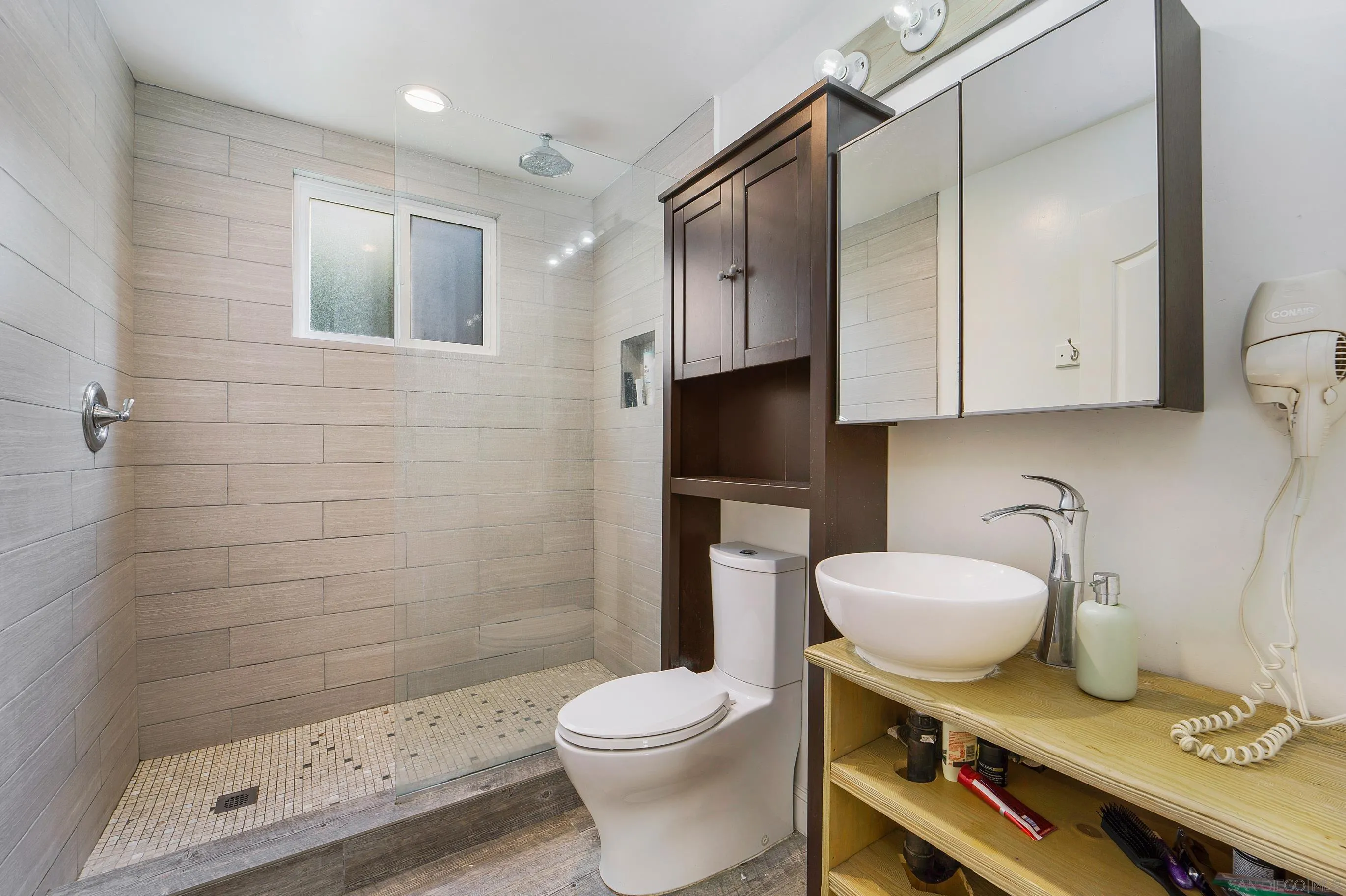149 Walnut Avenue Carlsbad, CA 92008 - Photo 29 of 48 a bathroom with a sink a toilet and shower