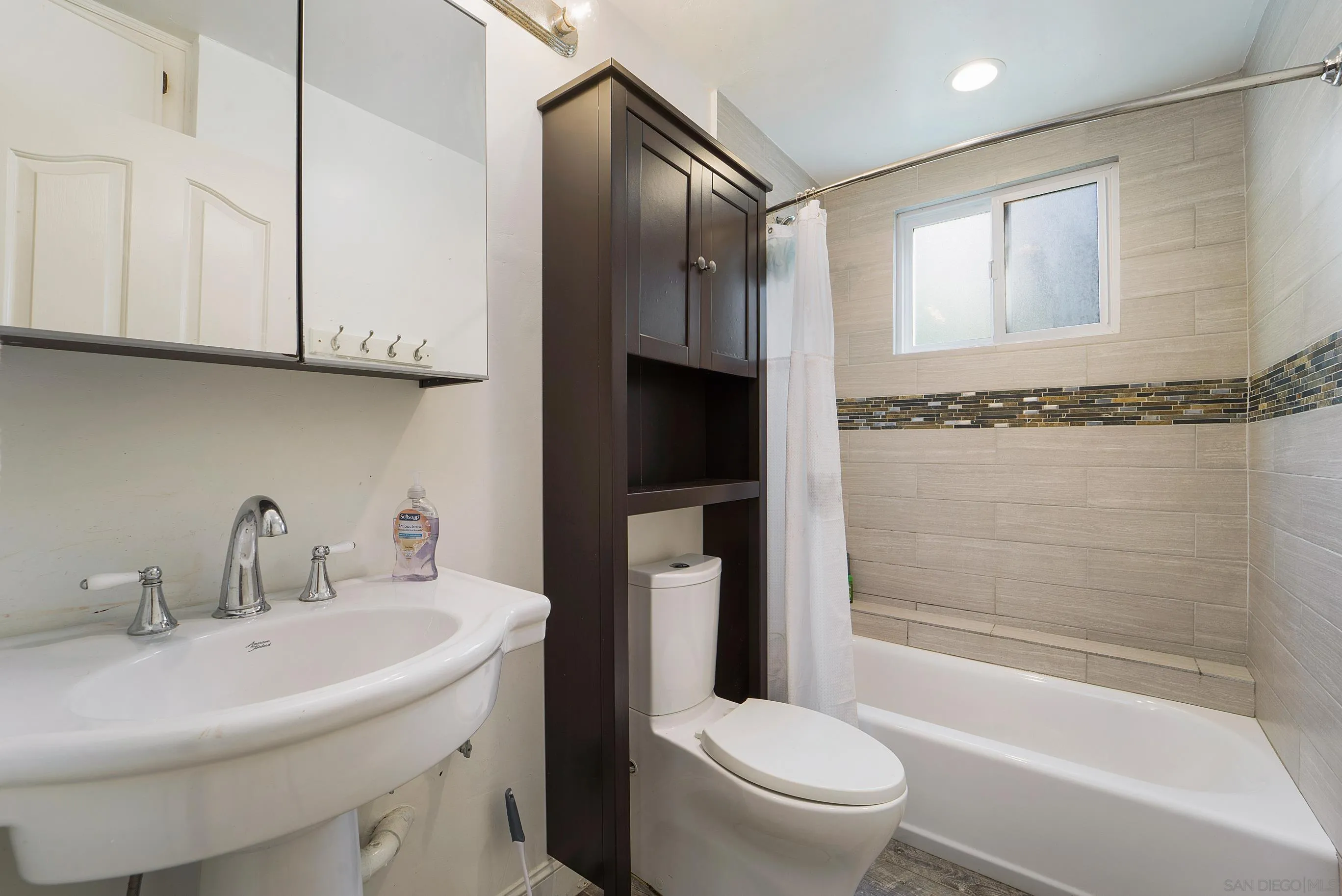 149 Walnut Avenue Carlsbad, CA 92008 - Photo 30 of 48 a bathroom with a sink toilet and shower