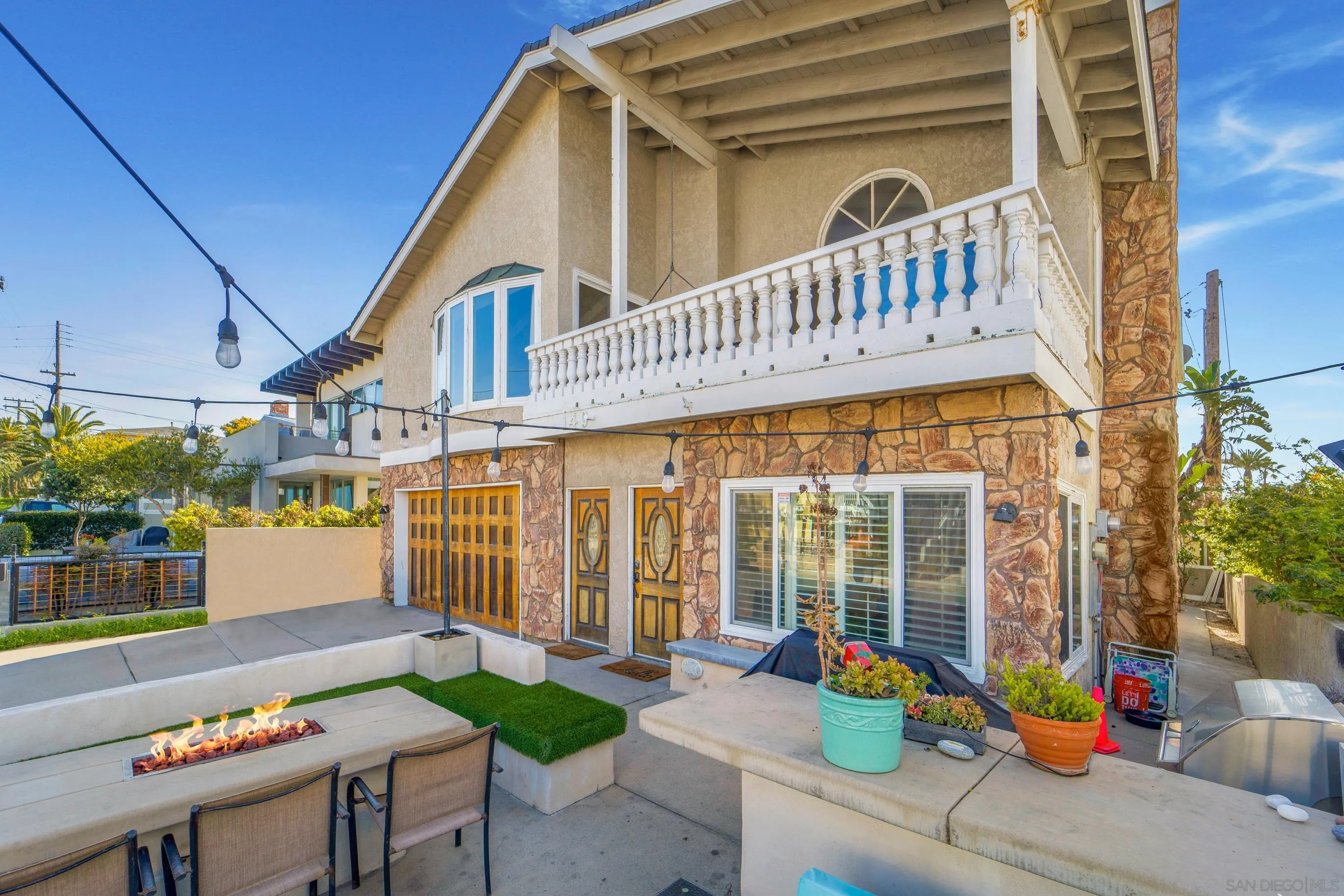 149 Walnut Avenue Carlsbad, CA 92008 - Photo 3 of 48 a balcony with furniture and potted plants