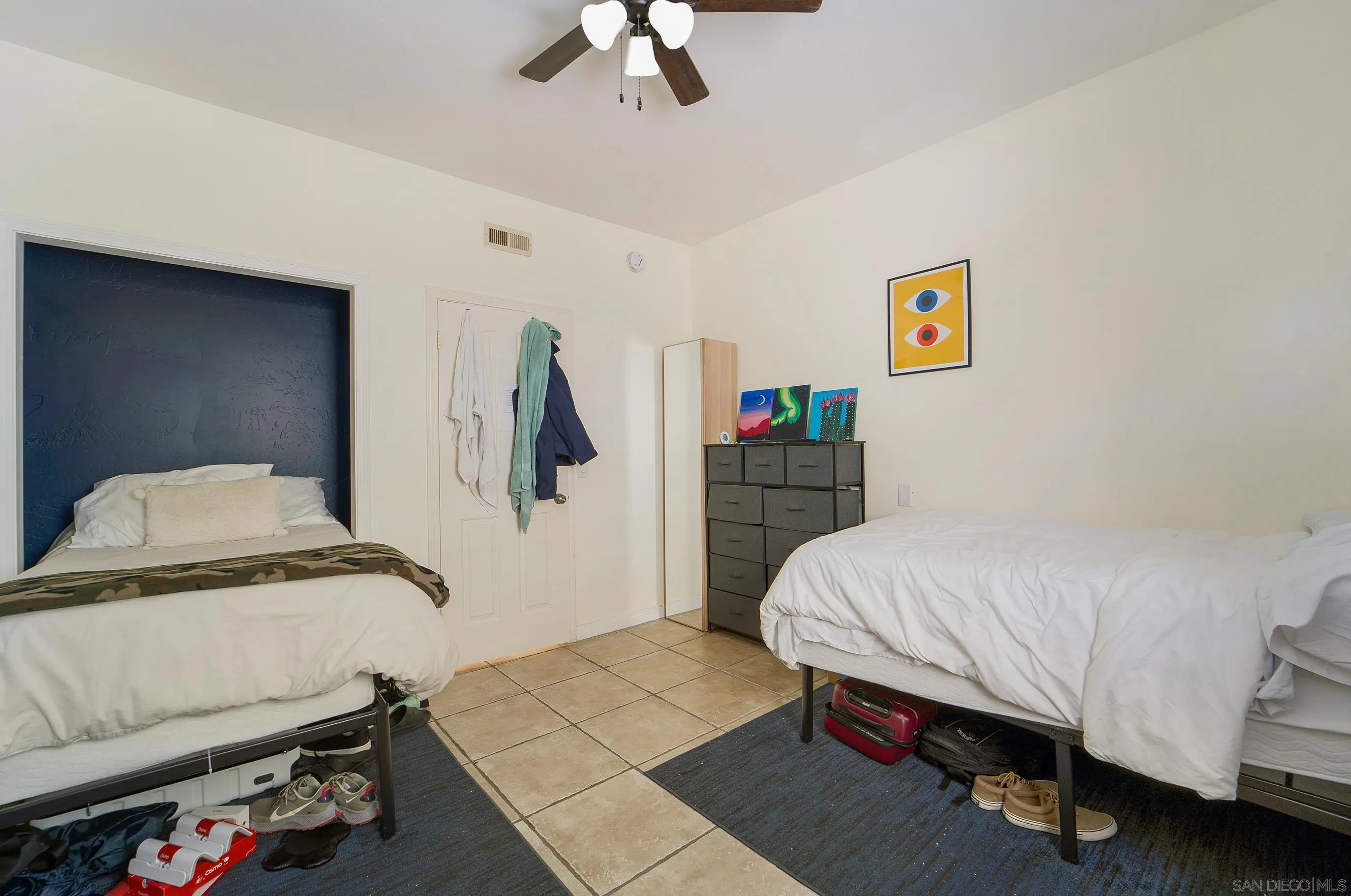 149 Walnut Avenue Carlsbad, CA 92008 - Photo 34 of 48 a bedroom with a bed and a dresser