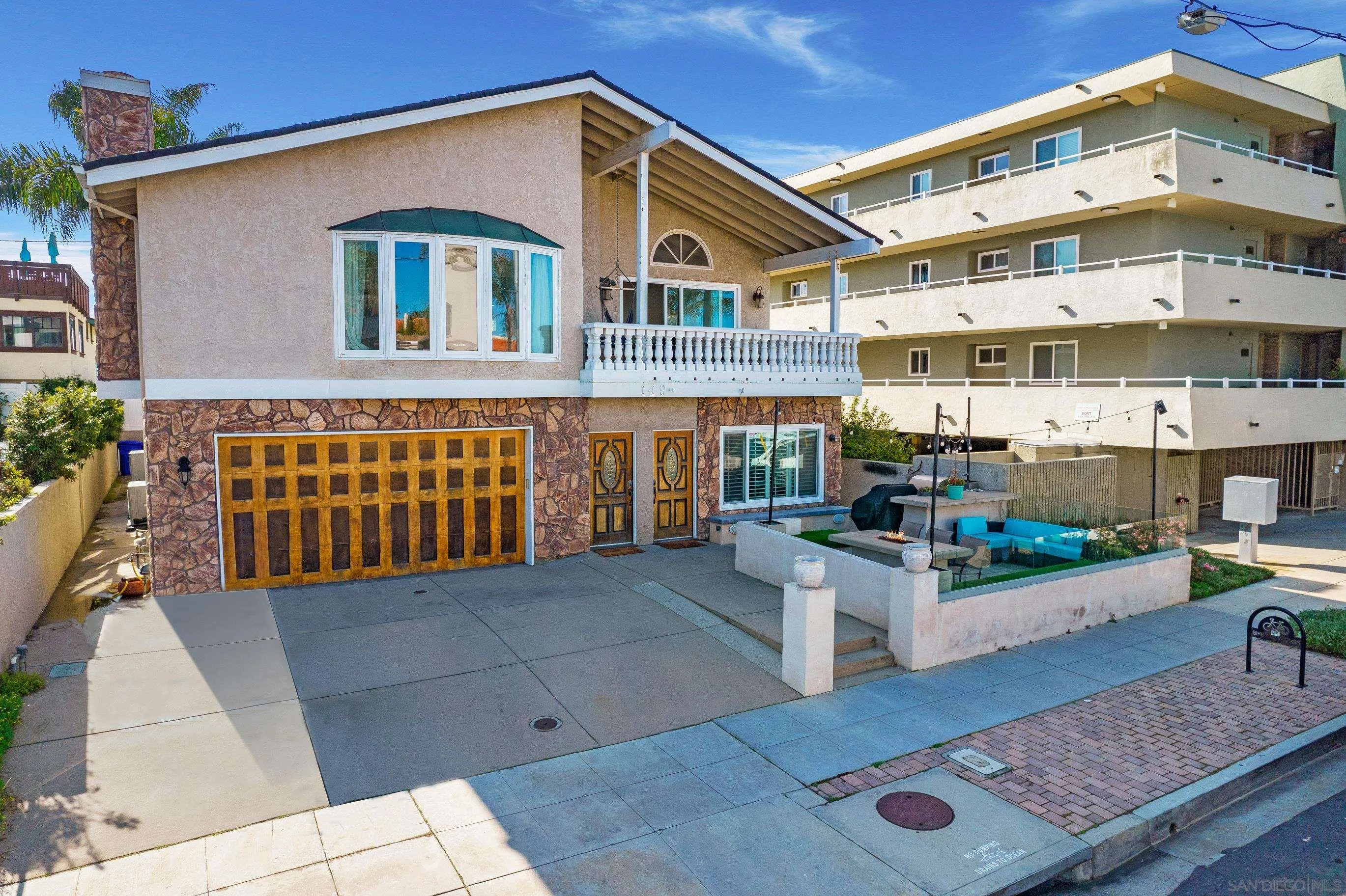 149 Walnut Avenue Carlsbad, CA 92008 - Photo 4 of 48 a view of a building with many windows