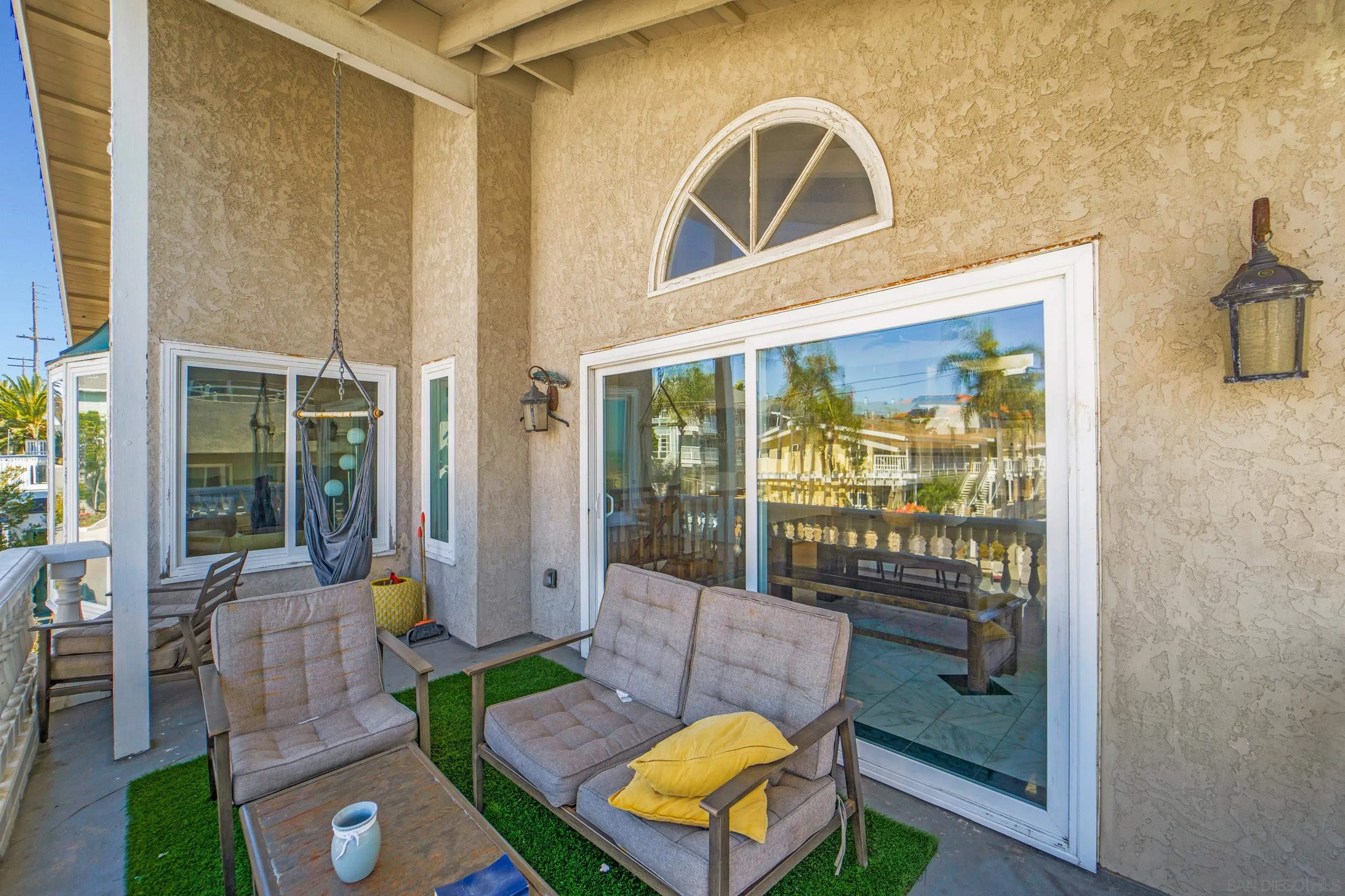 149 Walnut Avenue Carlsbad, CA 92008 - Photo 5 of 48 a view of a patio with couches chairs and a potted plant