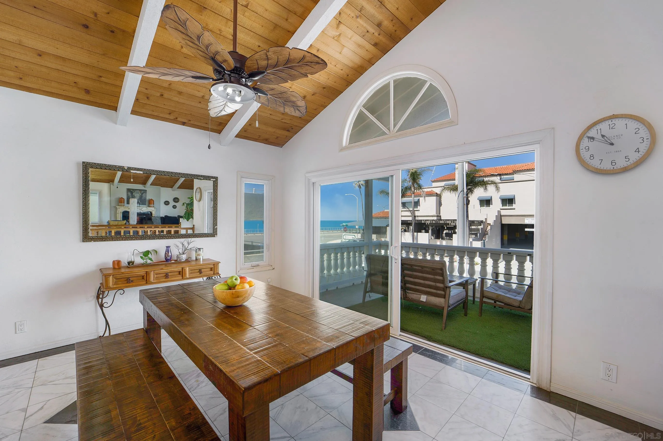 149 Walnut Avenue Carlsbad, CA 92008 - Photo 9 of 48 a view of a dining room with furniture and chandelier