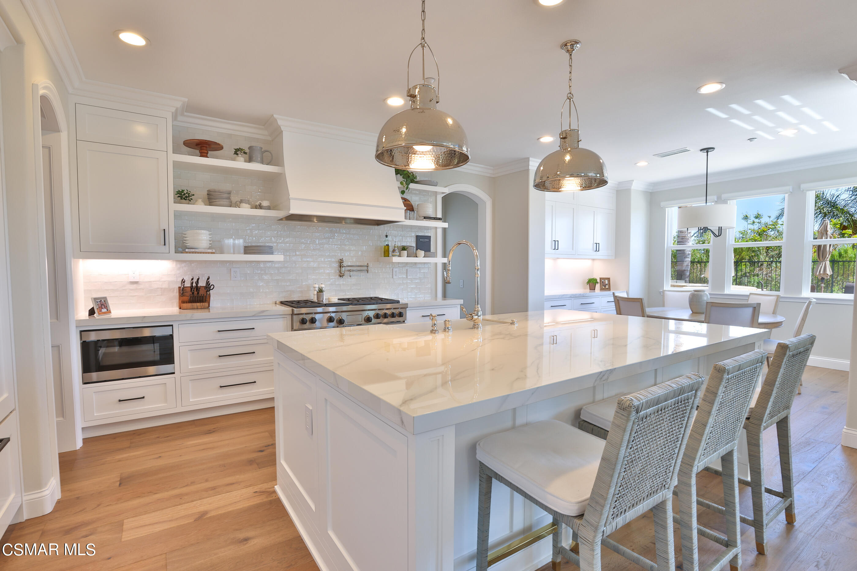 14168 Maya Circle Moorpark, CA 93021 - Photo 22 of 56 a large kitchen with kitchen island a large island in it
