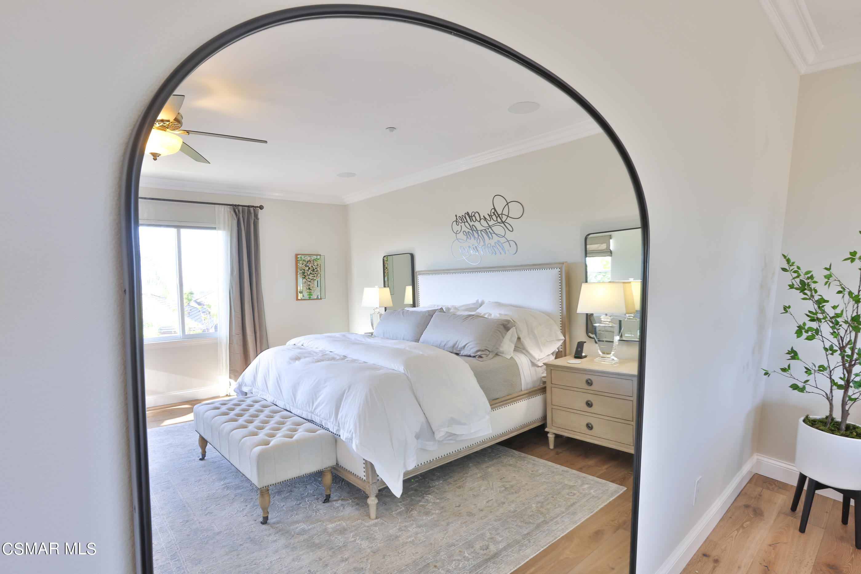 14168 Maya Circle Moorpark, CA 93021 - Photo 40 of 56 a bedroom with a bed and a mirror