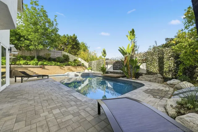 a view of a house with a yard porch and sitting area
