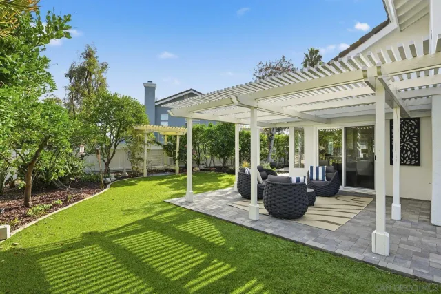 a balcony with furniture and a large window