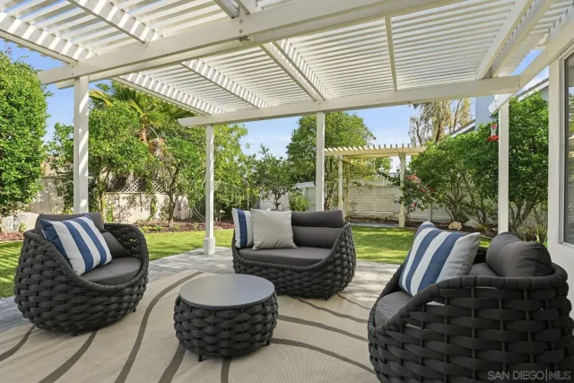 an aerial view of a residential apartment building with yard and parking