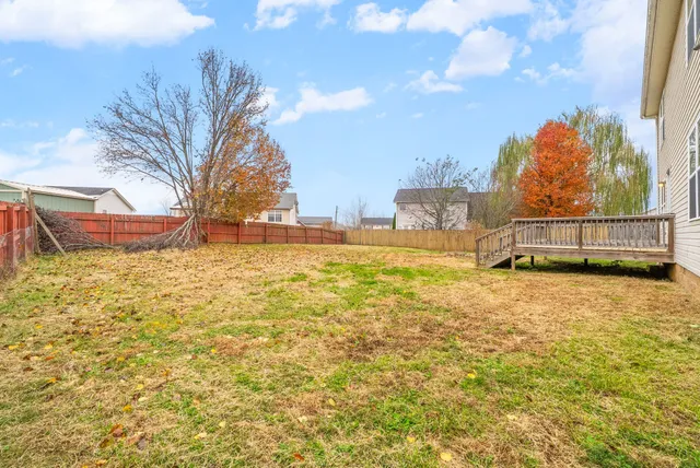 a view of a swimming pool with an outdoor space and seating area