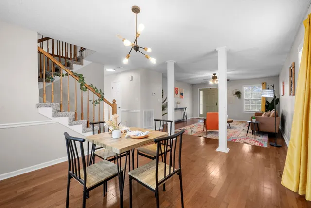 a view of a dining room with furniture and wooden floor