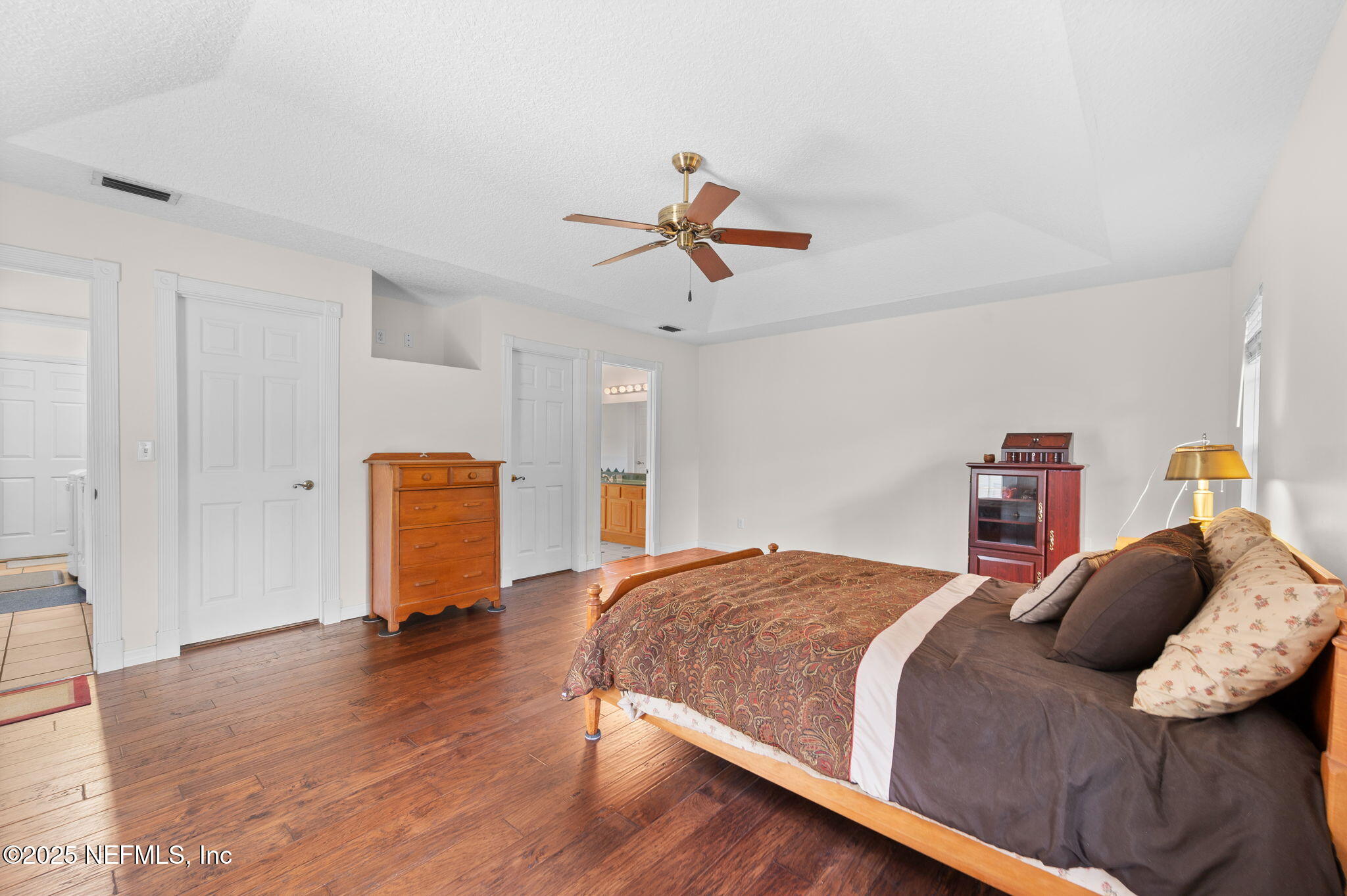 129 Linden Road St. Augustine, FL 32086 - Photo 23 of 56 a bedroom with a bed and wooden floor