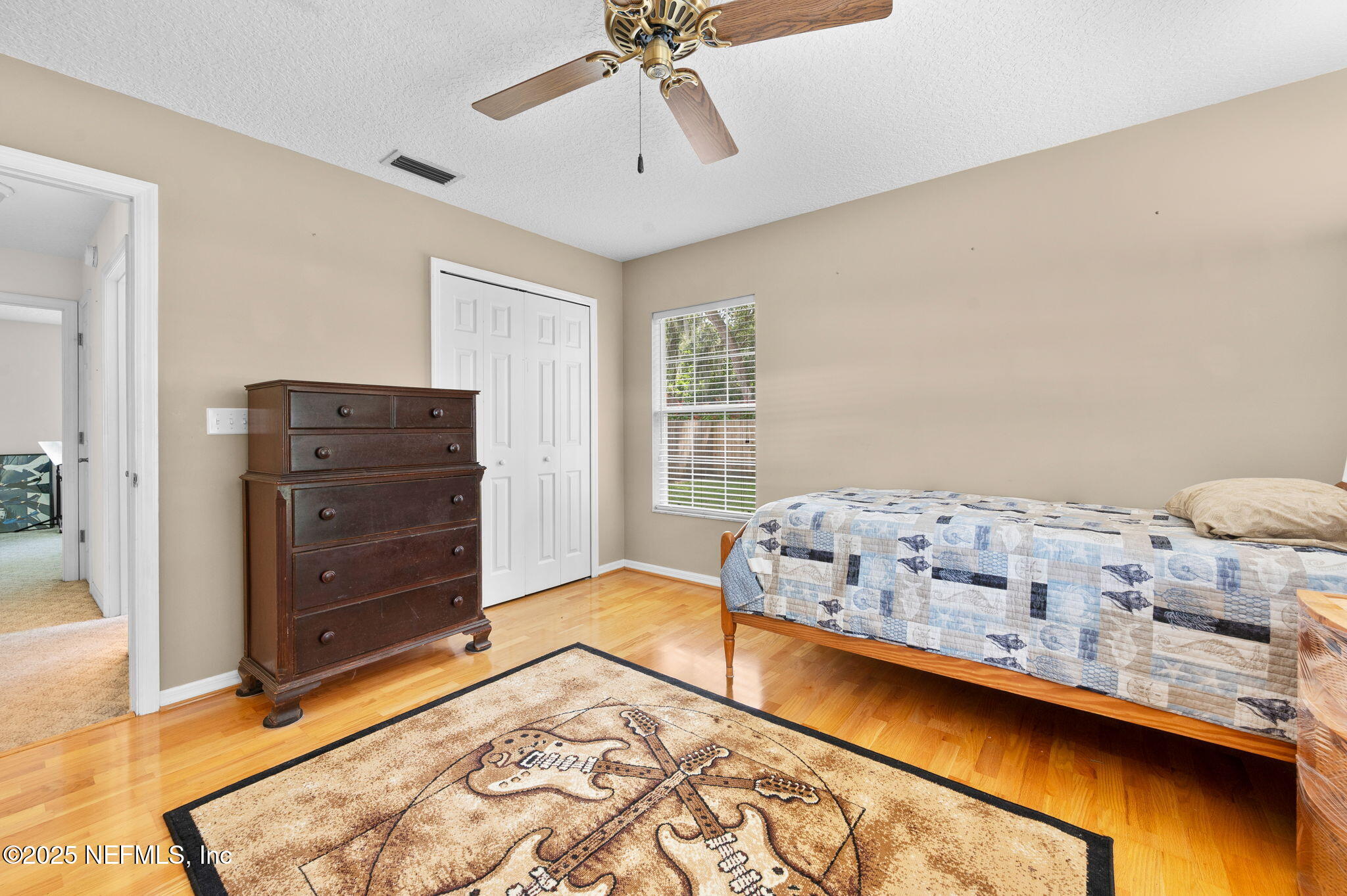 129 Linden Road St. Augustine, FL 32086 - Photo 30 of 56 a bedroom with a bed and a window