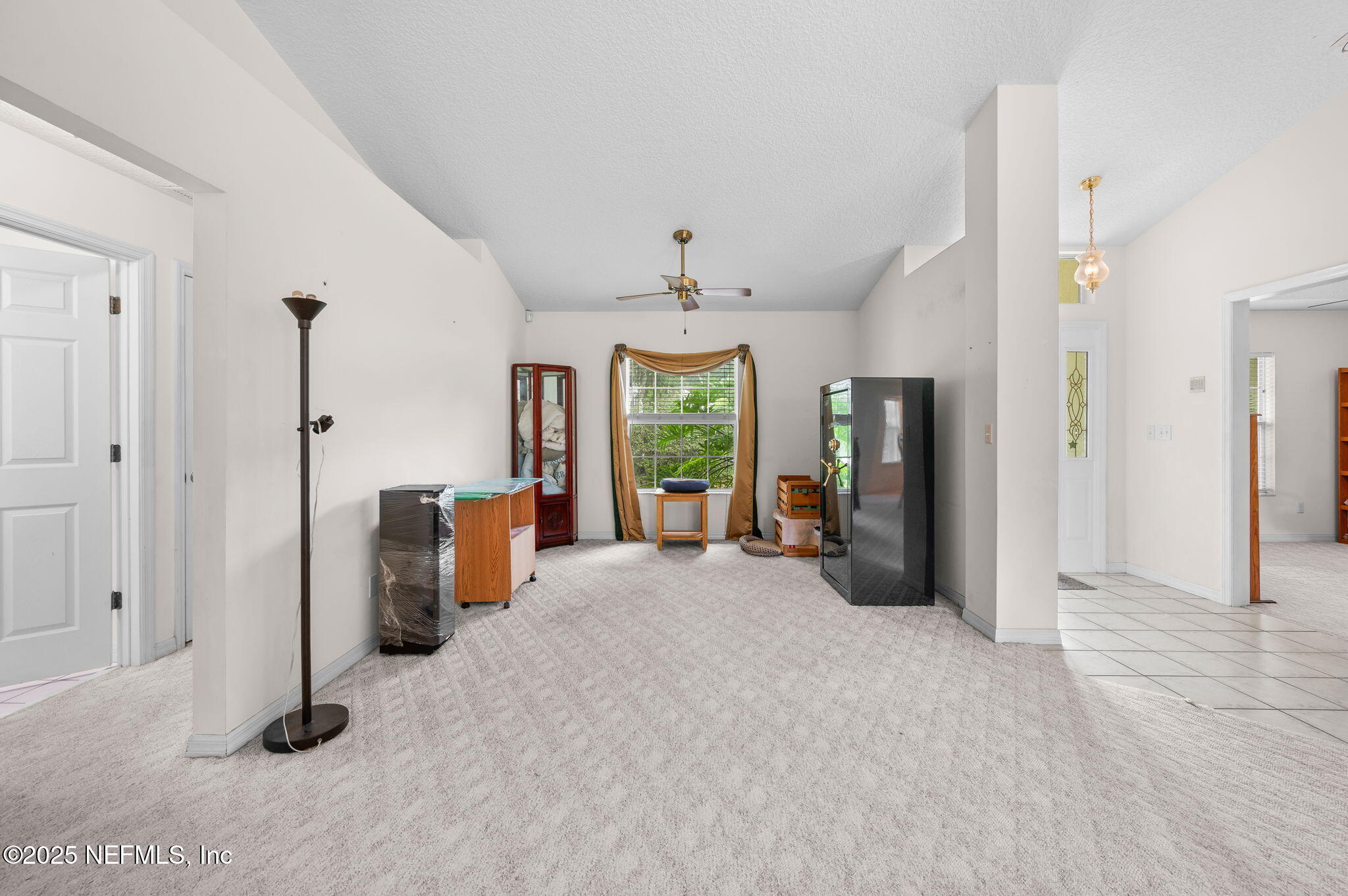 129 Linden Road St. Augustine, FL 32086 - Photo 9 of 56 a view of an empty room with a window