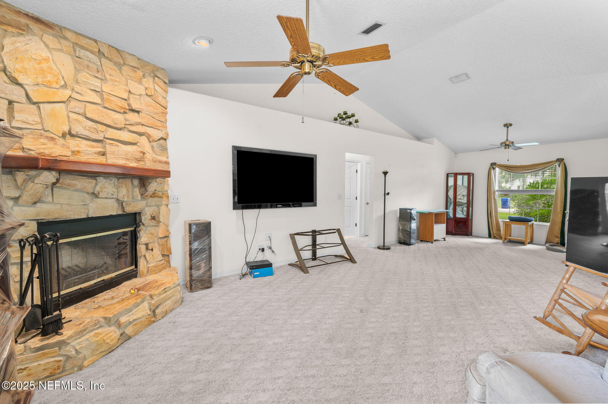 129 Linden Road St. Augustine, FL 32086 - Photo 10 of 56 a living room with furniture and a flat screen tv
