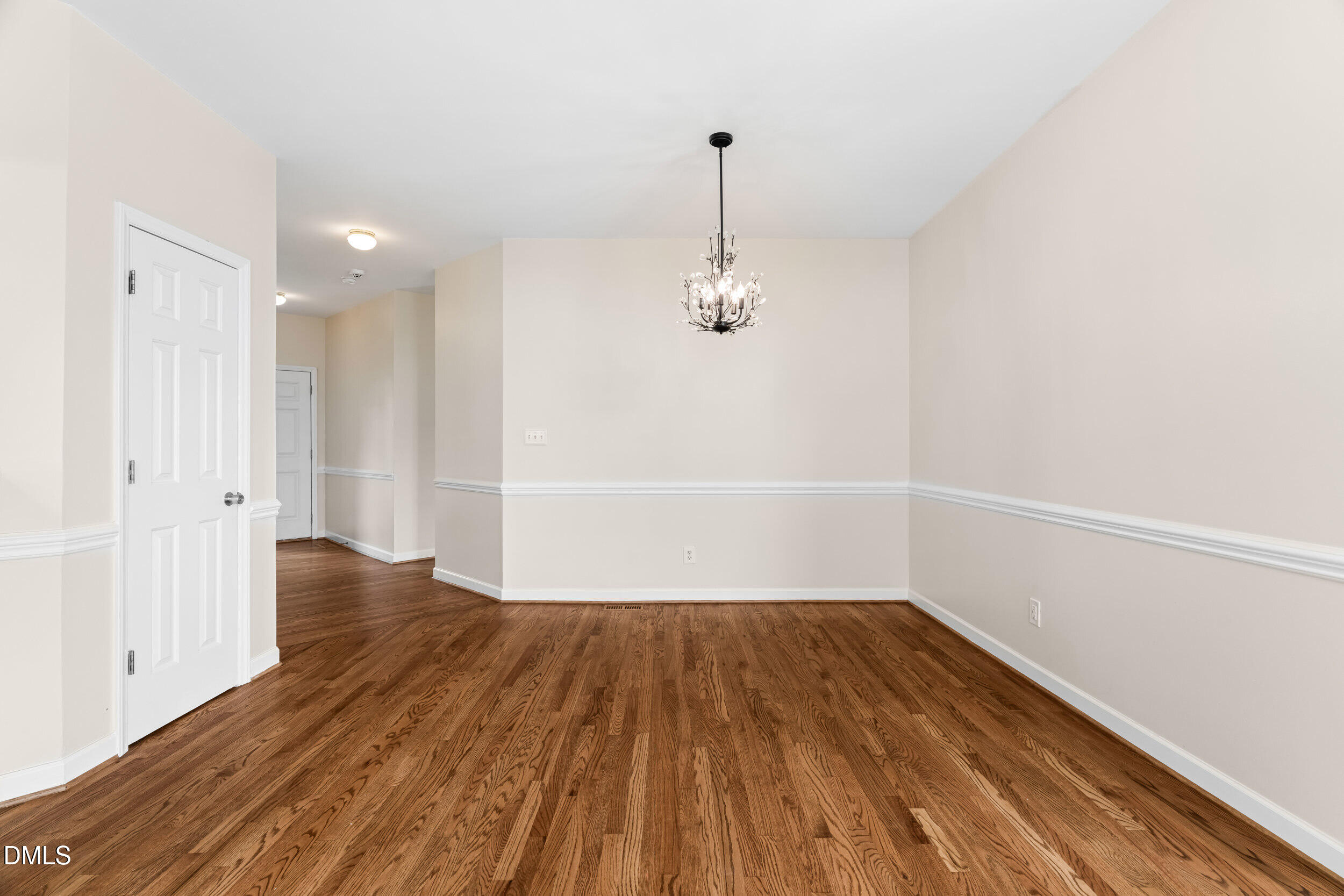 744 Seastone Street Raleigh, NC 27603 - Photo 12 of 53 a view of a room with wooden floor and window