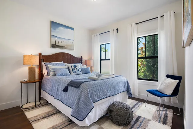 a bedroom with a bed and window