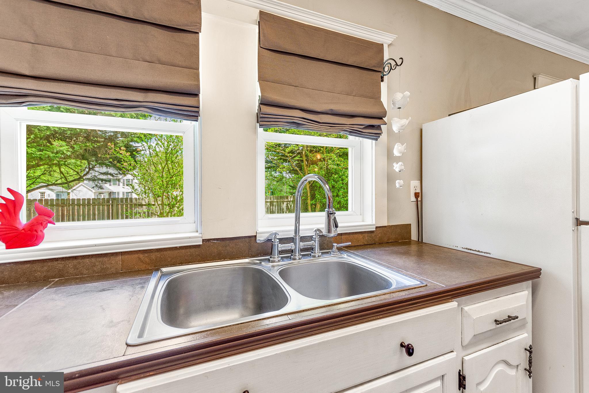 10035 H G Trueman Road Lusby, MD 20657 - Photo 16 of 38 Windows over sink provide a view
