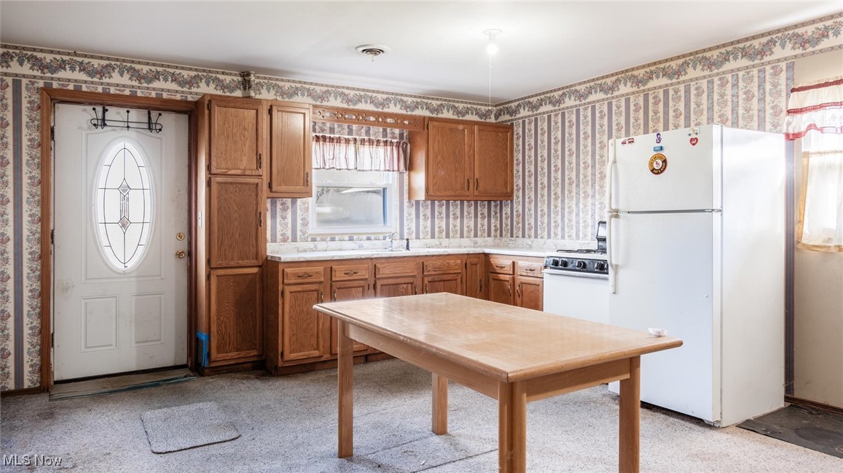 1950 Newark Road Zanesville, OH 43701 - Photo 34 of 39 Kitchen with white appliances and sink