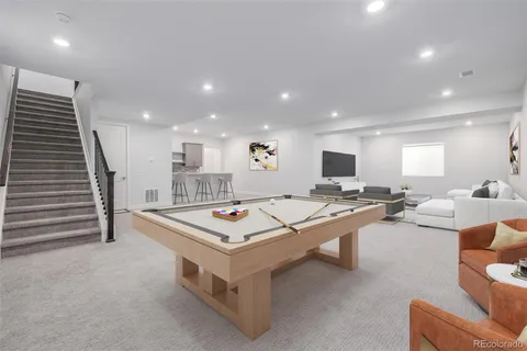 a bedroom with a bed and a lamp on dresser