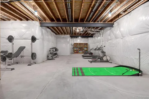 a room with gym equipment and a large window