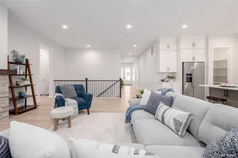 a living room with furniture and a rug