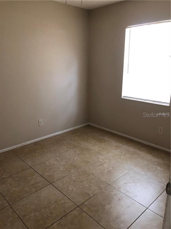 2278 19th Avenue Southwest Largo, FL 33774 - Photo 5 of 11 a view of an empty room with a window