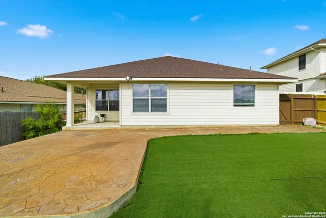 a view of a house with pool and yard