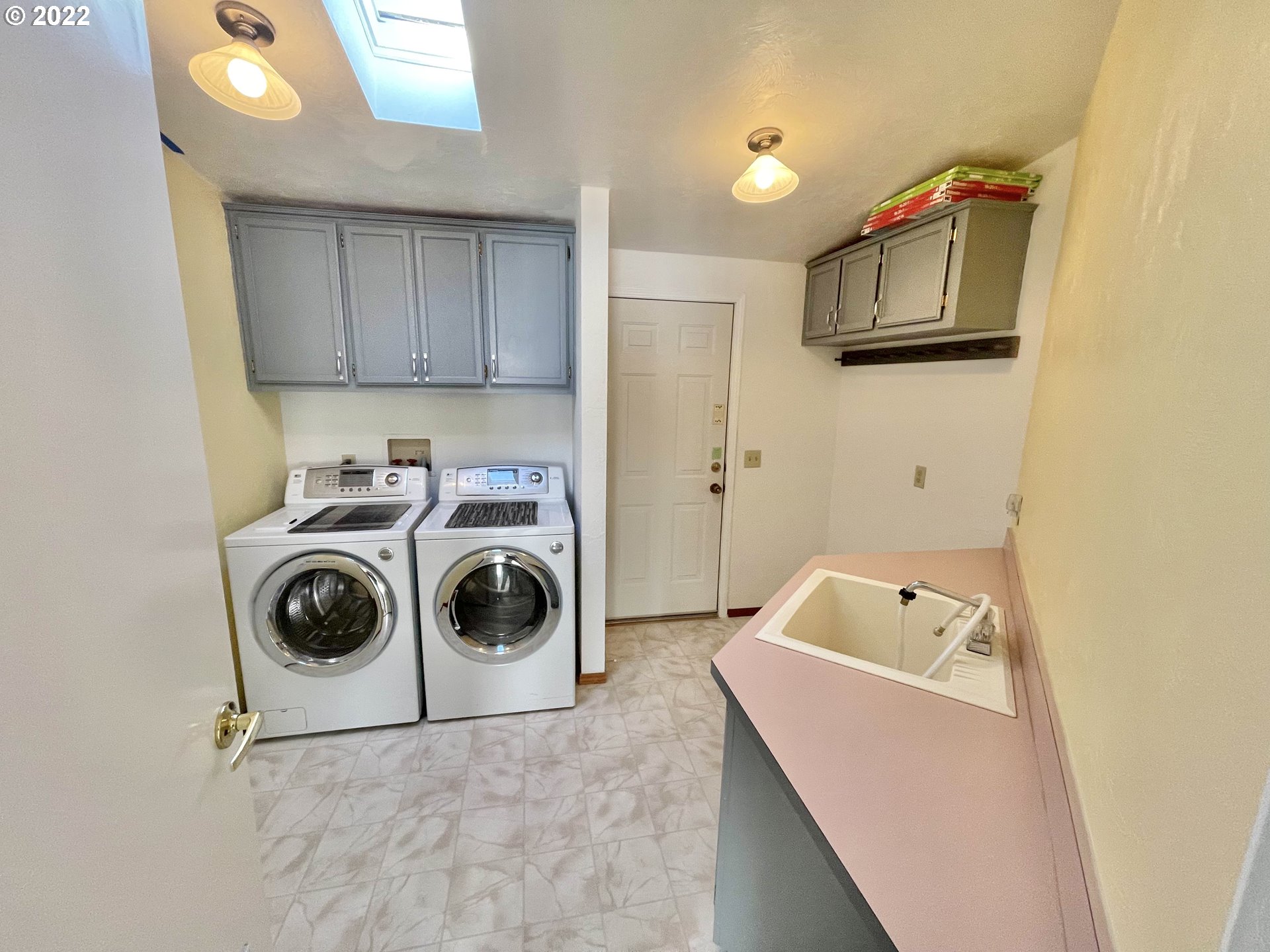 100 River Bend Road, Unit 101 Reedsport, OR 97467 - Photo 15 of 30 a utility room with sink dryer and washer