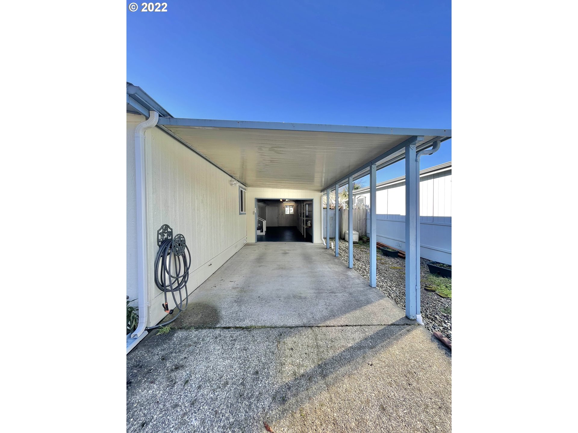 100 River Bend Road, Unit 101 Reedsport, OR 97467 - Photo 18 of 30 a view of a livingroom with a patio and a yard