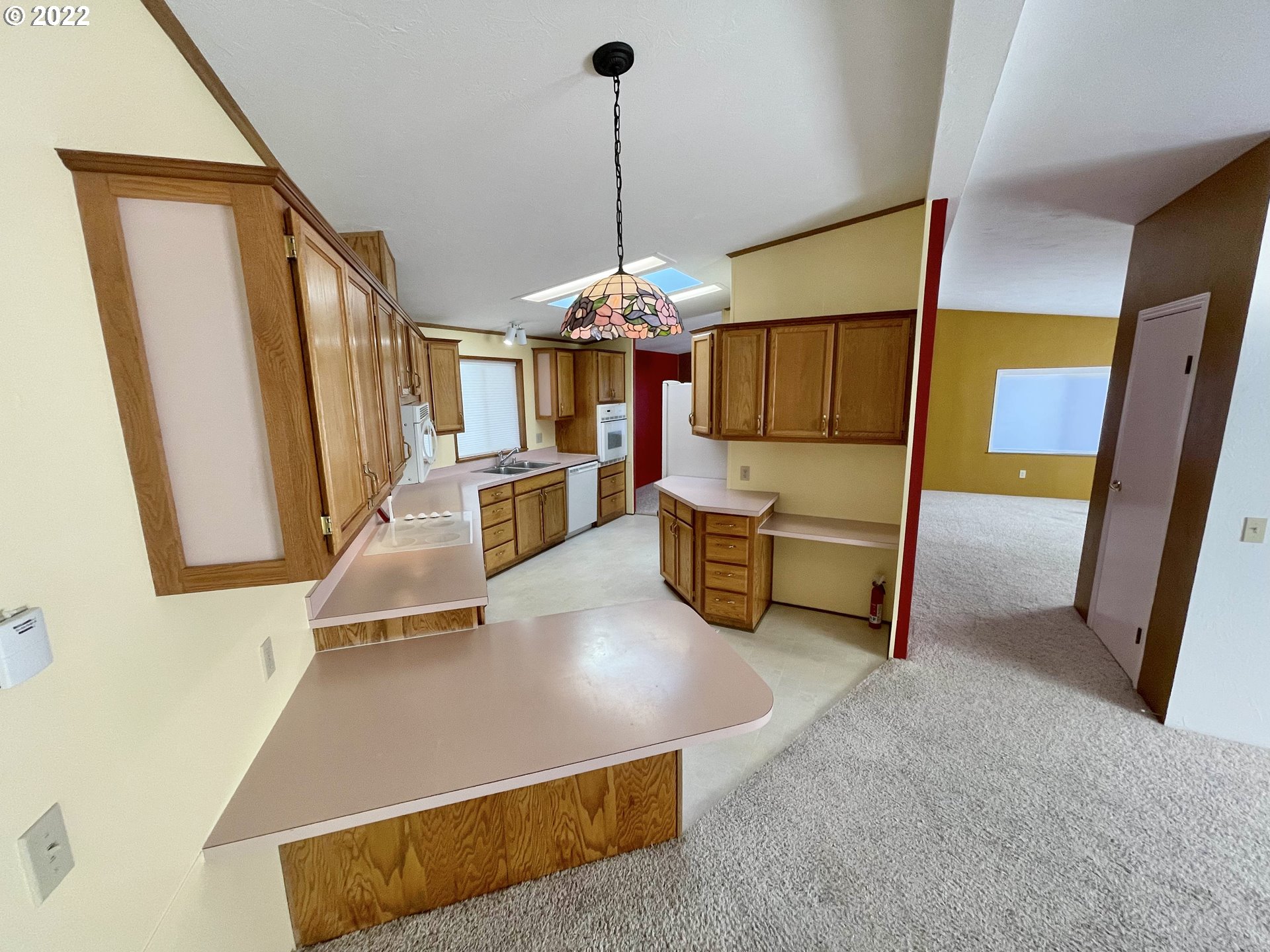 100 River Bend Road, Unit 101 Reedsport, OR 97467 - Photo 2 of 30 a living room with furniture and flat screen tv