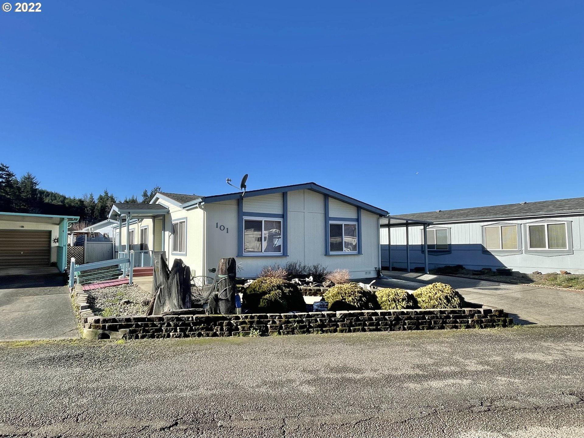 100 River Bend Road, Unit 101 Reedsport, OR 97467 - Photo 25 of 30 a front view of a building with cars parked
