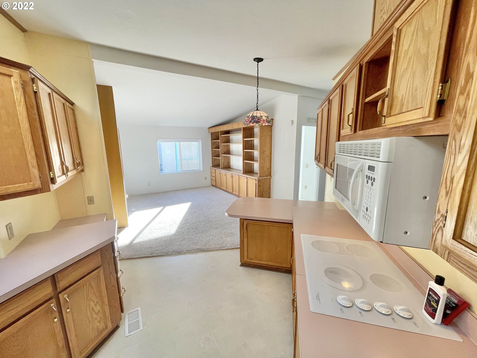 100 River Bend Road, Unit 101 Reedsport, OR 97467 - Photo 3 of 30 a living room with furniture and a flat screen tv