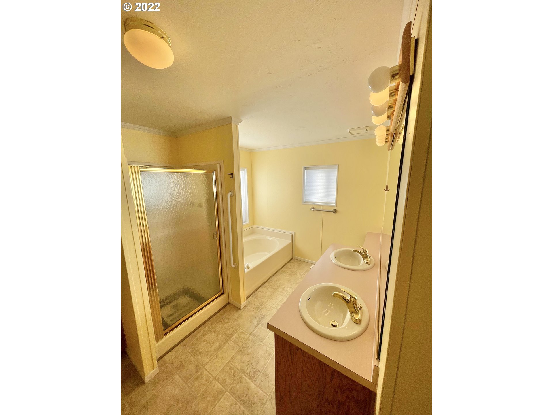 100 River Bend Road, Unit 101 Reedsport, OR 97467 - Photo 8 of 30 a bathroom with a sink and a mirror