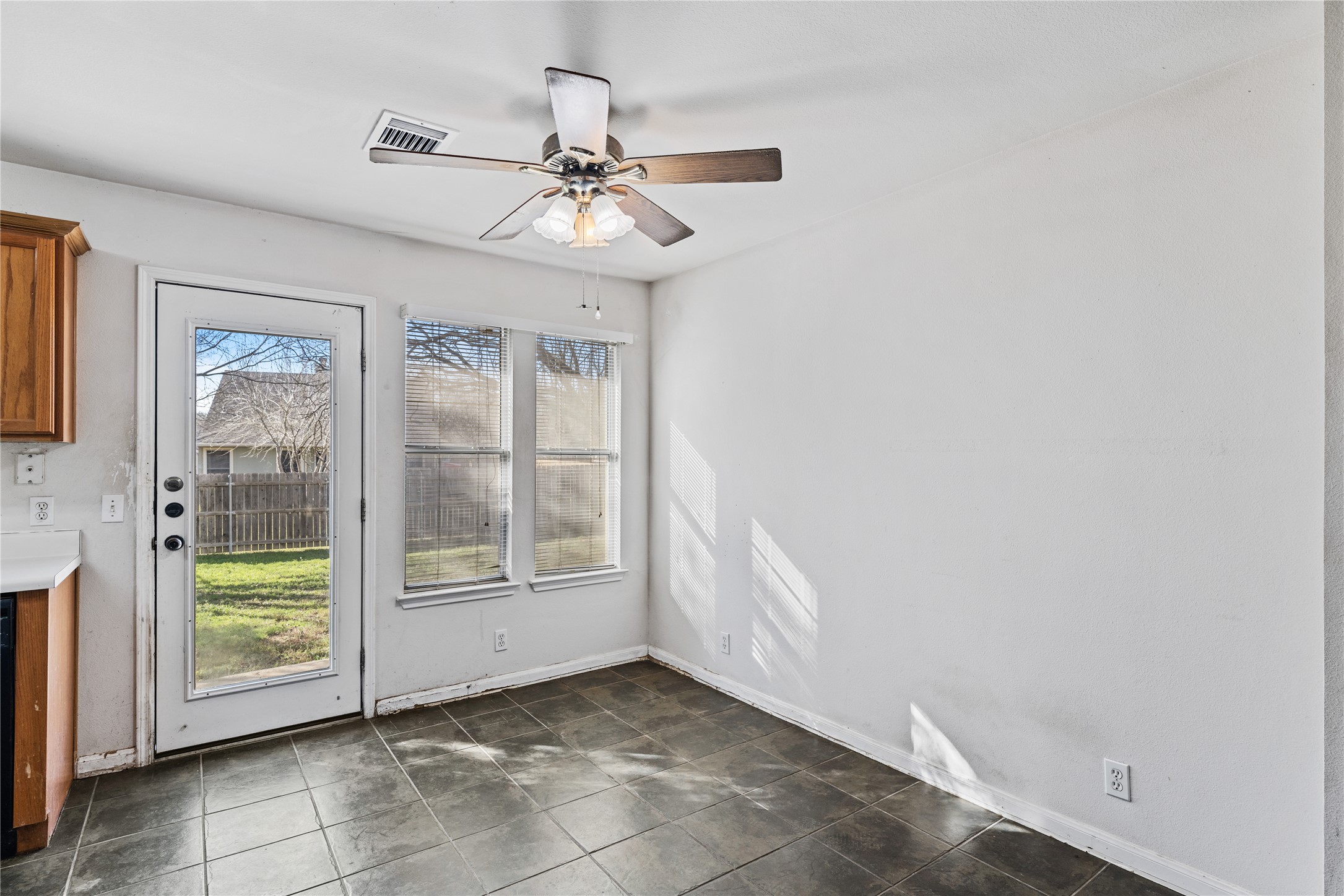 600 Tobin Drive Buda, TX 78610 - Photo 5 of 21 Unfurnished dining area featuring ceiling fan